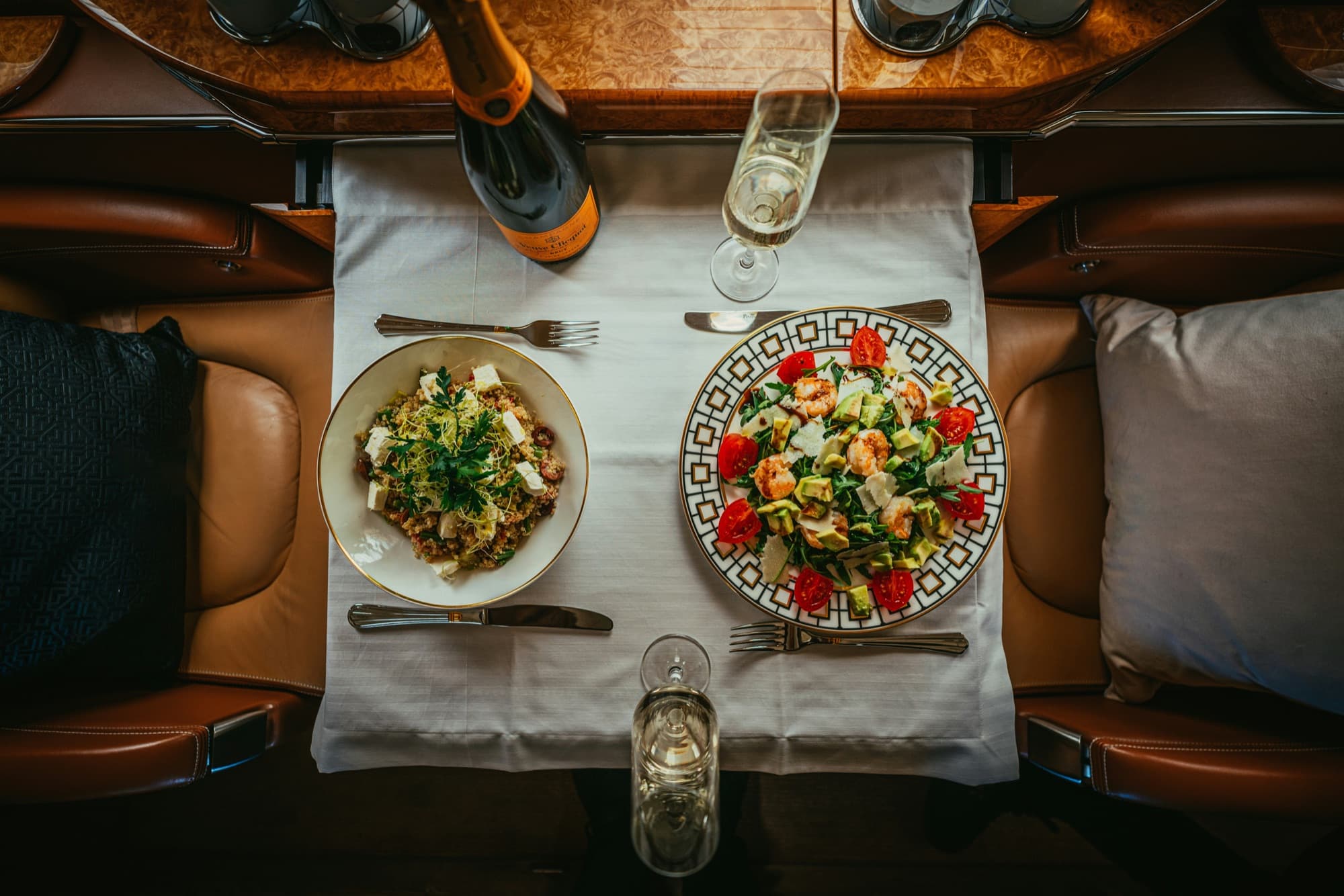 Overhead view of an intimate dinner for two with champagne